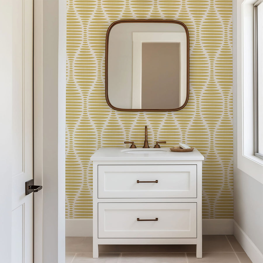 Bathroom vanity with mirror against a Ogee Sketch Ovals Wallpaper - Mustard Yellow