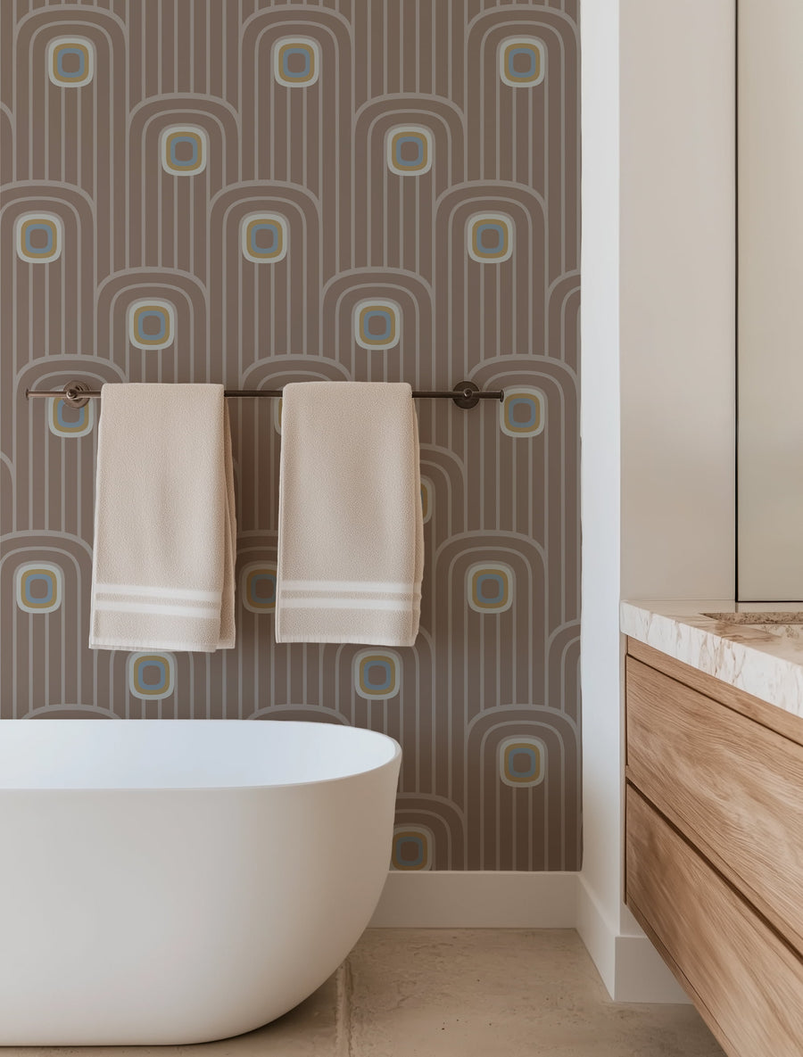 Bathroom with a freestanding bathtub, towel rack, and Brown 70s Retro Mod Arch Geometric Wallpaper