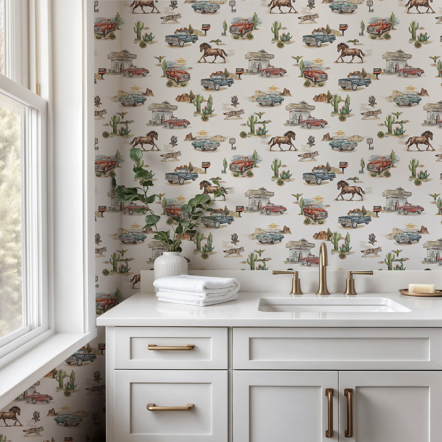 Bathroom with white vanity, gold fixtures, and Cream Western Wallpaper