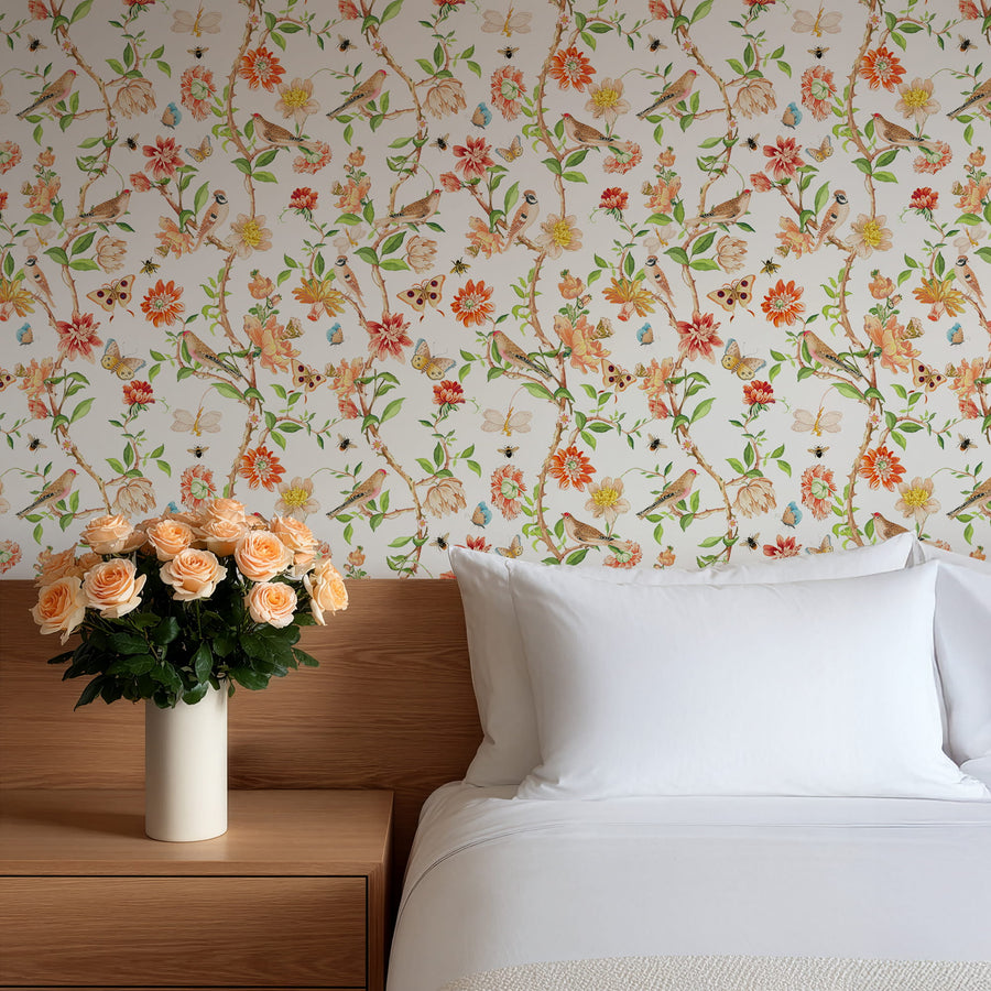 Bedroom with Chinoiserie Garden Wallpaper – Birds, Butterflies & Blooms wooden nightstand, and vase of flowers.