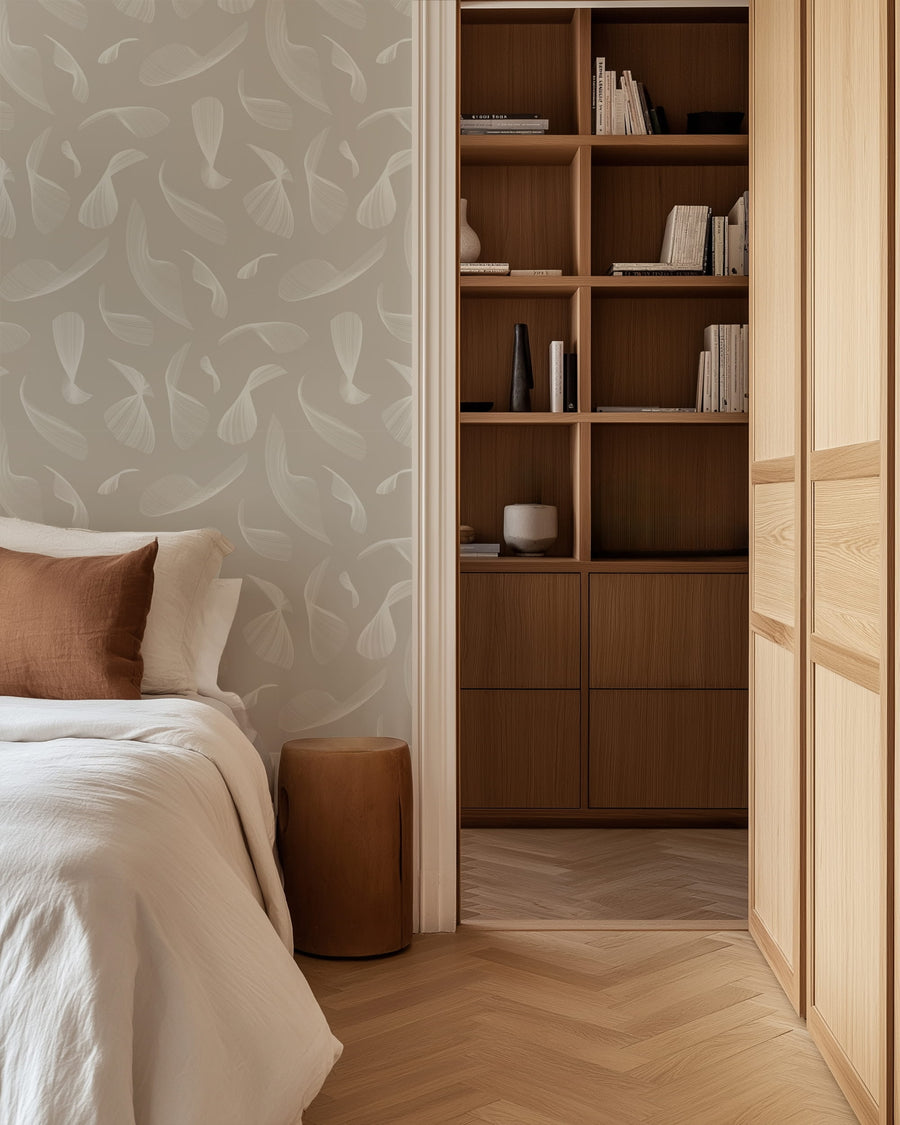 Bedroom with wooden bookshelf and Quill Whispers Wallpaper – Warm Taupe