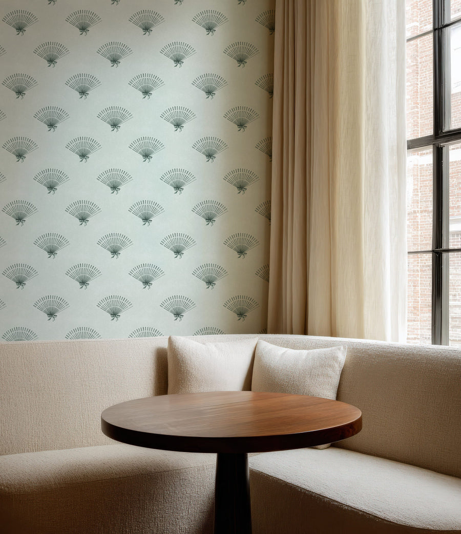 Beige sofa with a wooden table against a Mint Green Preppy Coquette Bow Fan Wallpaper