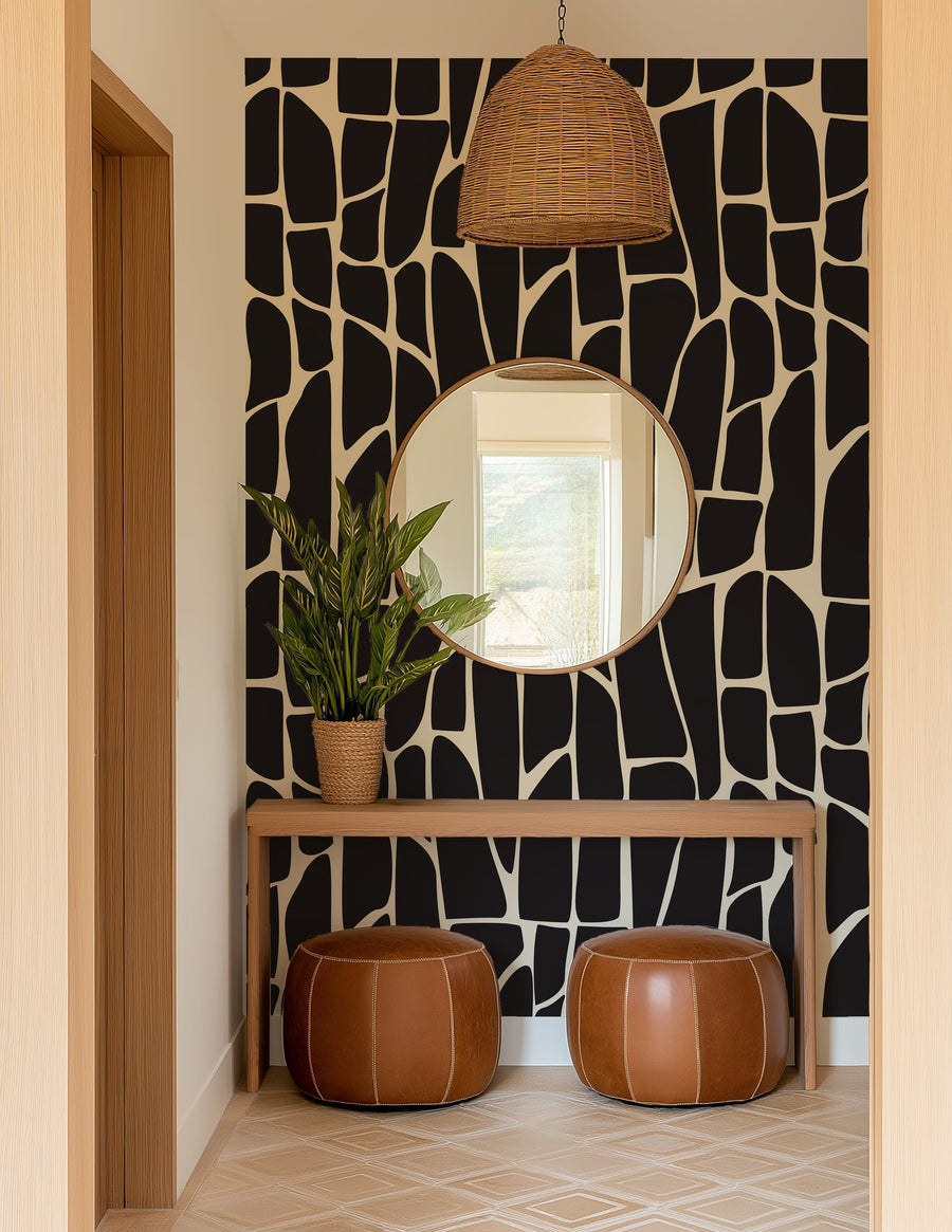 Foyer with Black & White Organic Geometric Wallpaper - Abstract Mosaic Shapes, round mirror, and brown ottomans