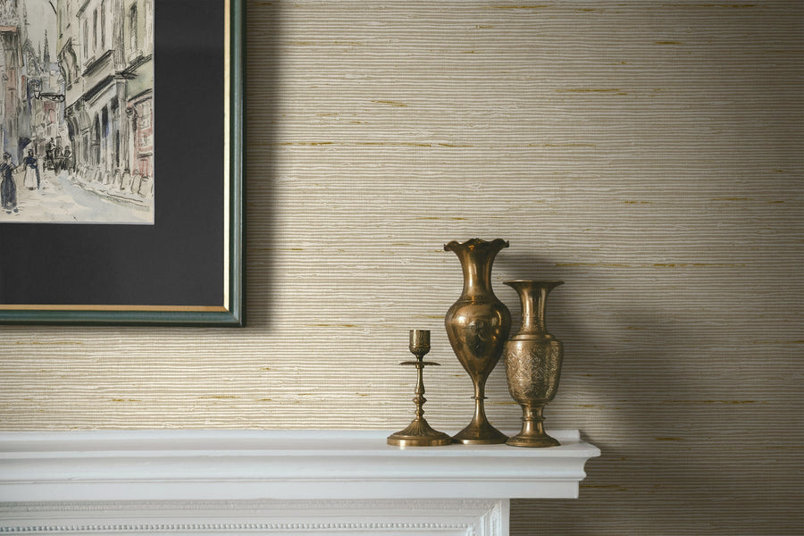 Decorative vases on a mantelpiece with a framed picture above, against a textured wall.
