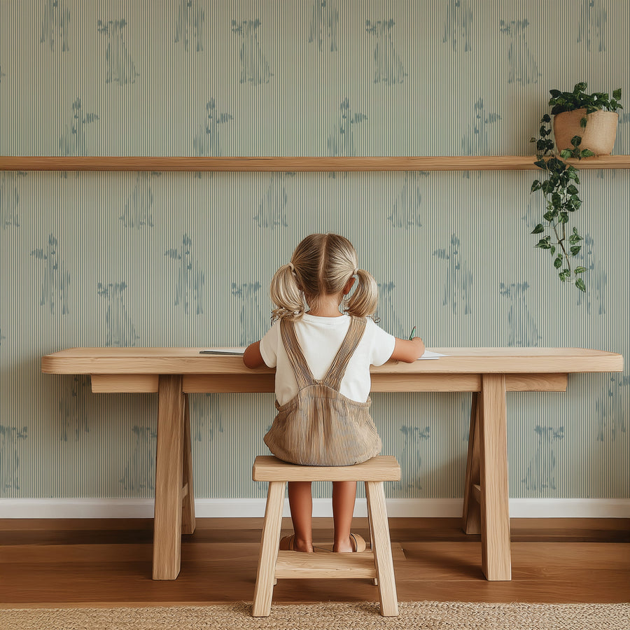 Child sitting at a wooden table in a room with Blue Stripe Playful Dog Silhouette Wallpaper and shelves