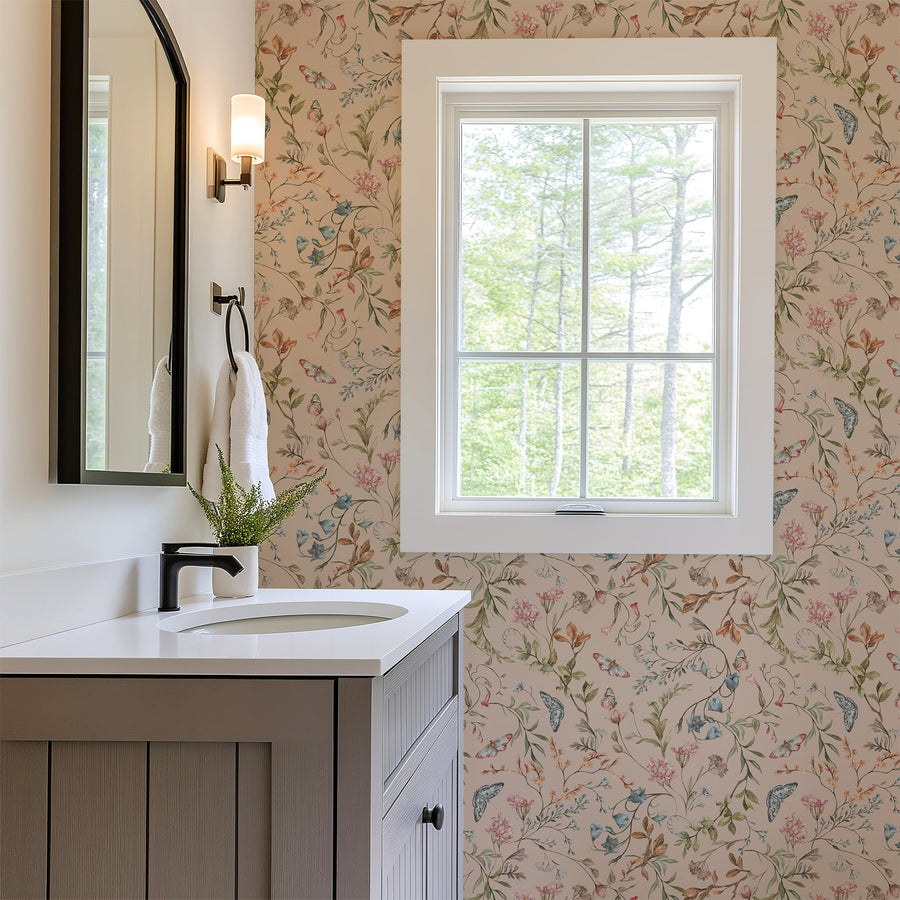 Bathroom with floral wallpaper, sink, and window