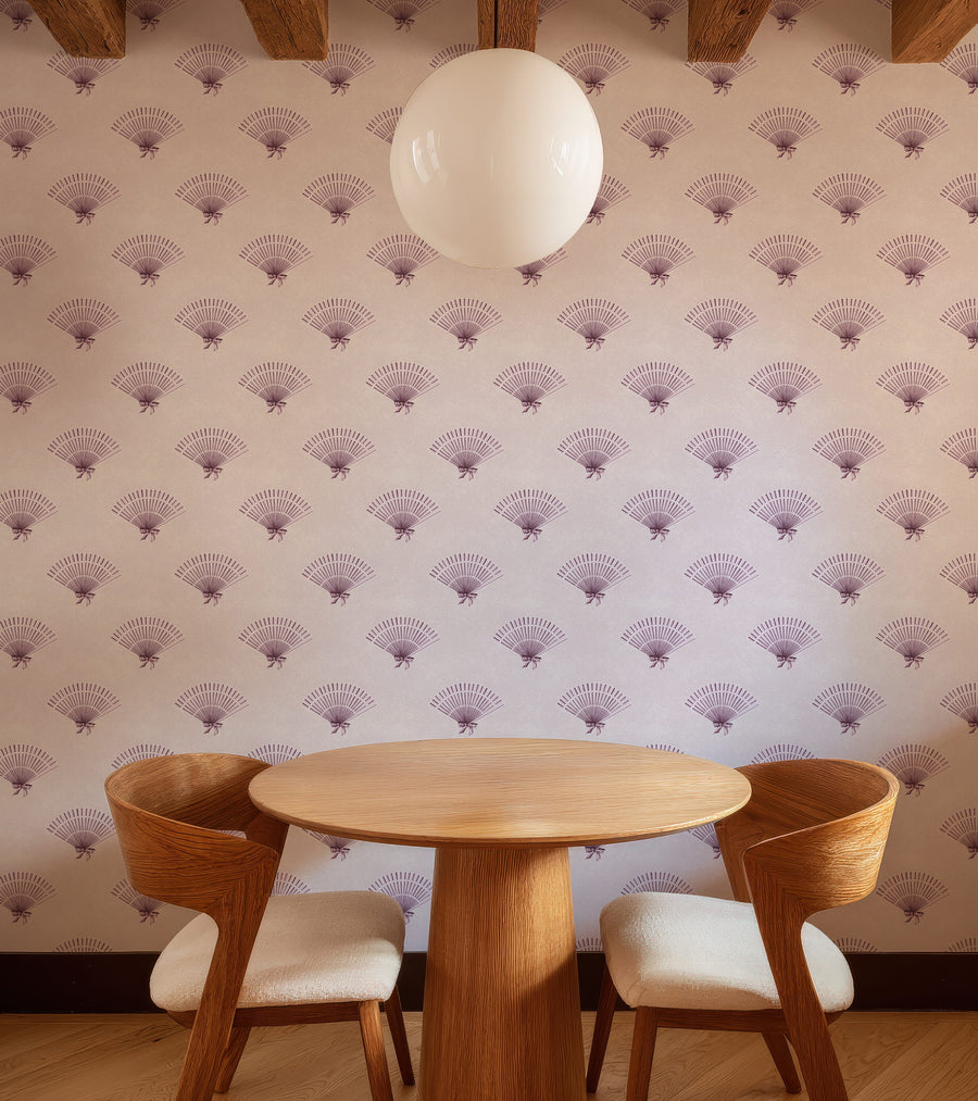 Dining area with a round wooden table and chairs against a Light Pink Coquette Preppy Bow Fan Wallpaper