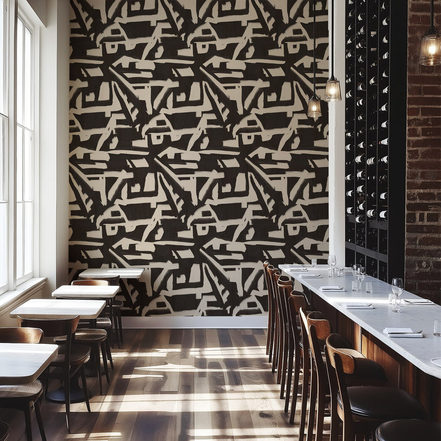 Modern restaurant interior with abstract geometric wallpaper, tables, and chairs