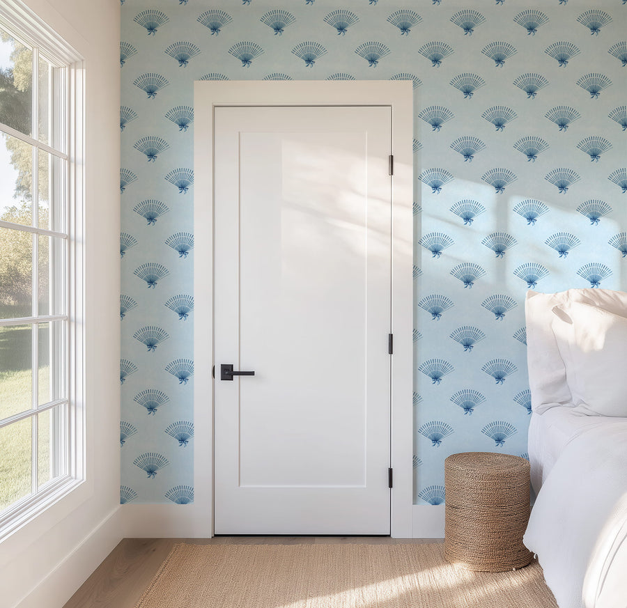 Room interior with white door, Blue Coquette Preppy Bow Fan Wallpaper, and a window.