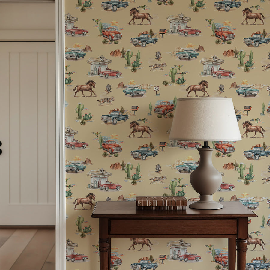 Sand Western Wallpaper featuring cars, horses, and cacti.n, lamp on wooden table.