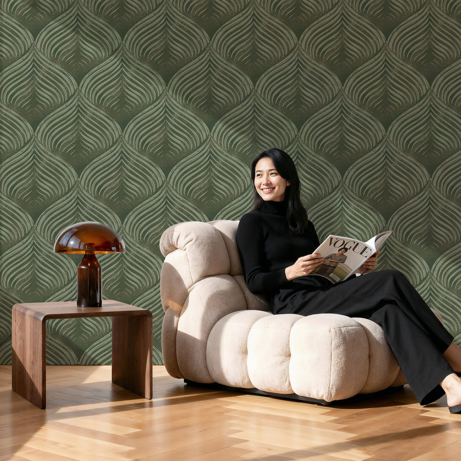 Woman reading a magazine in a stylish living room with Abstract Petals Wallpaper - Green Art Deco Blockprint