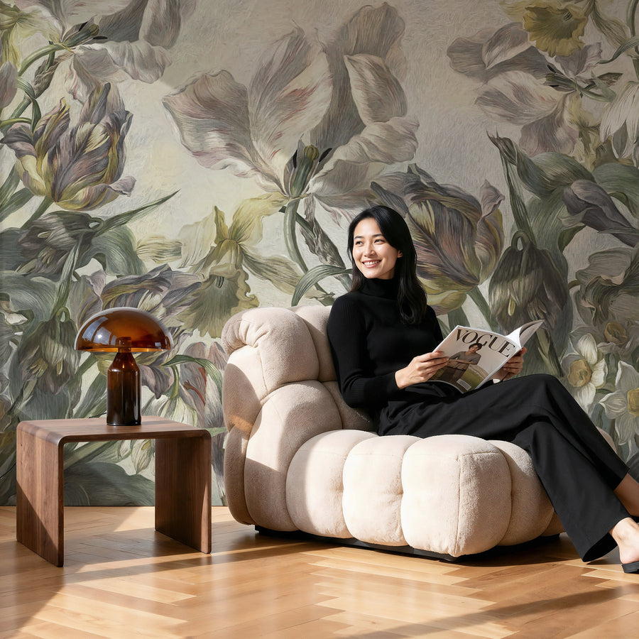 Woman reading a magazine on a beige armchair with Historical Dutch Tulip Floral Wall Mural