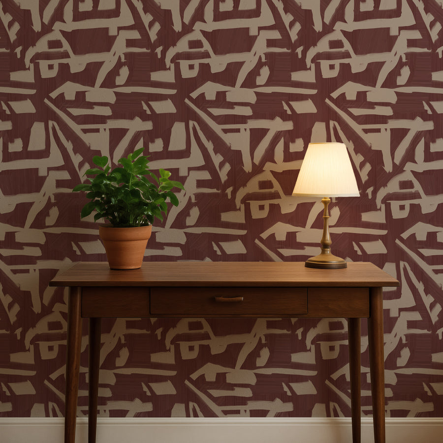 Console table with potted plant and table lamp featuring Abstract Brushstroke Wallpaper Burgundy Taupe accent wall