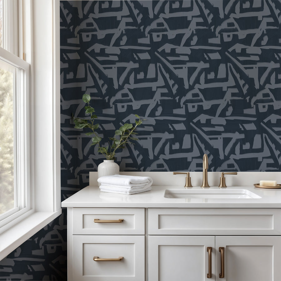 Bathroom with white vanity gold faucet and folded towels featuring Abstract Brushstroke Wallpaper Navy Slate Blue by Petra Kohlmayr