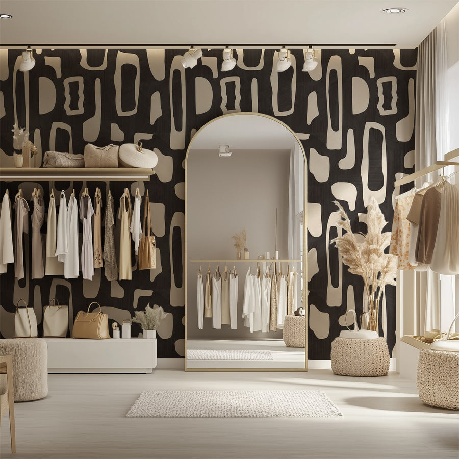 Boutique dressing room with arched mirror clothing rail and sculptural display featuring Abstract Organic Shapes Wallpaper Black Cream