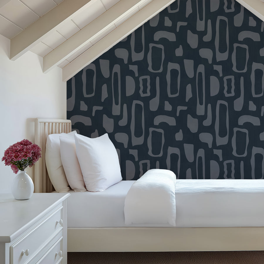 Bedroom with white bedding and upholstered headboard featuring Abstract Organic Shapes Wallpaper Navy Slate Blue accent wall