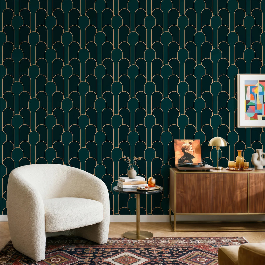 Emerald green and gold Art Deco arch wallpaper in a sitting room with a cream boucle chair and wood credenza