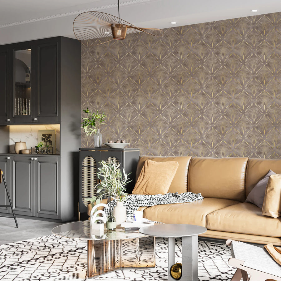 Brown and gold Art Deco fan wallpaper in a living room with a tan sofa and dark wood cabinetry
