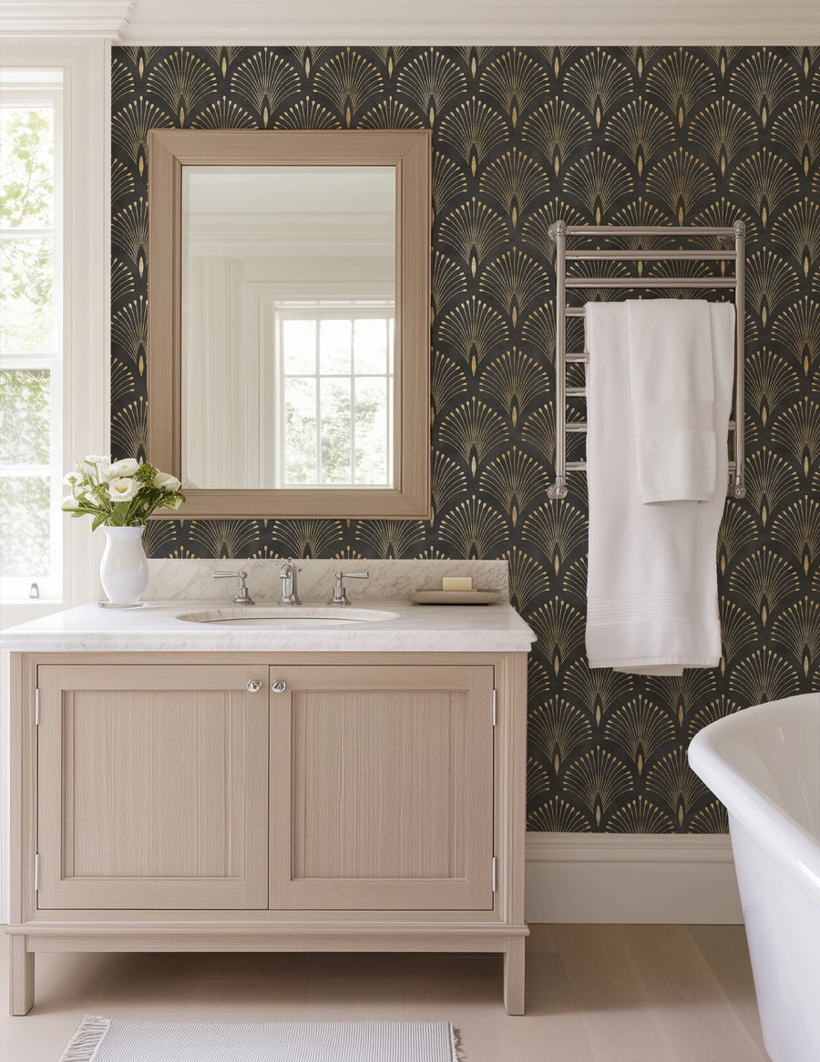 Art deco black and gold fan wallpaper in a bathroom with a wood vanity