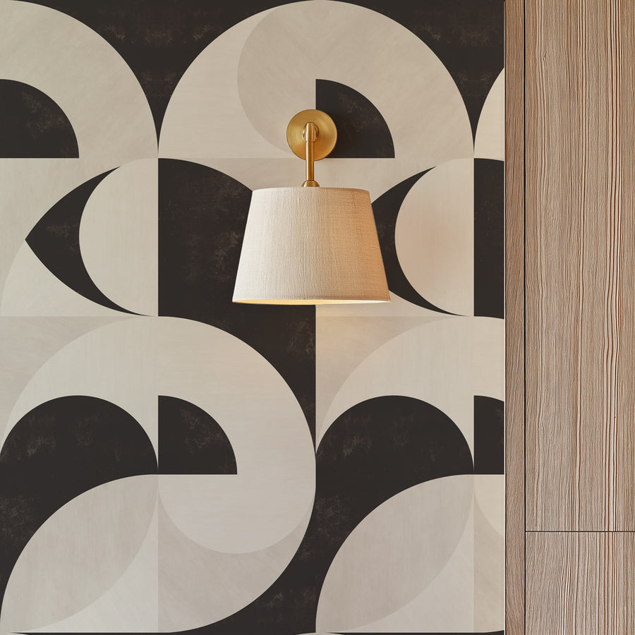 Entryway with brass wall light and wood panel accent featuring Bauhaus Geometric Shapes Wallpaper Espresso Cream