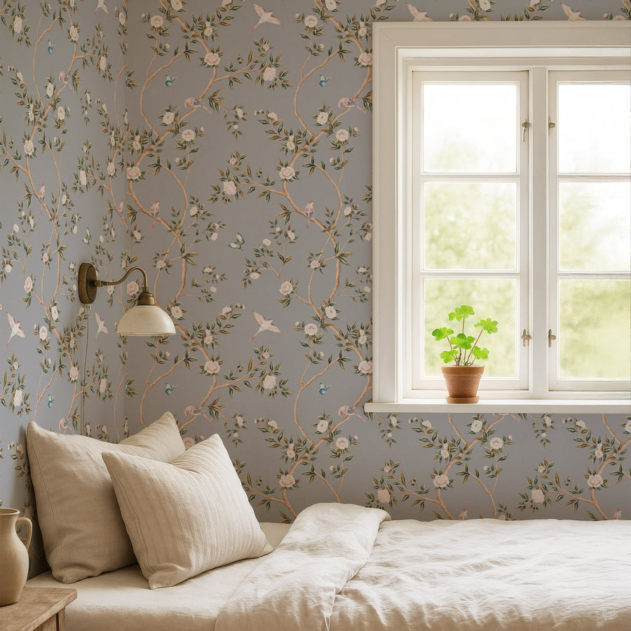 Bedroom with cream bedding and window featuring Blue Chinoiserie Hemma Wallpaper Floral Garden Birds accent wall