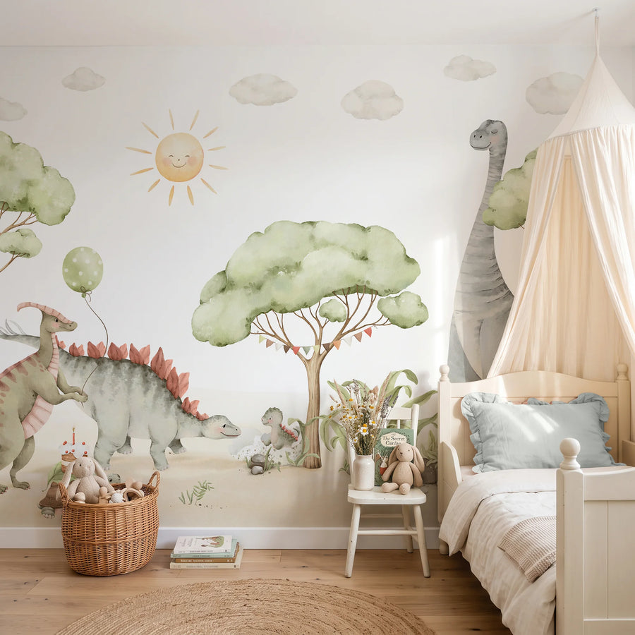 Dinosaur nursery wall mural with watercolor baby dinos, a balloon and soft sage trees behind a canopy bed