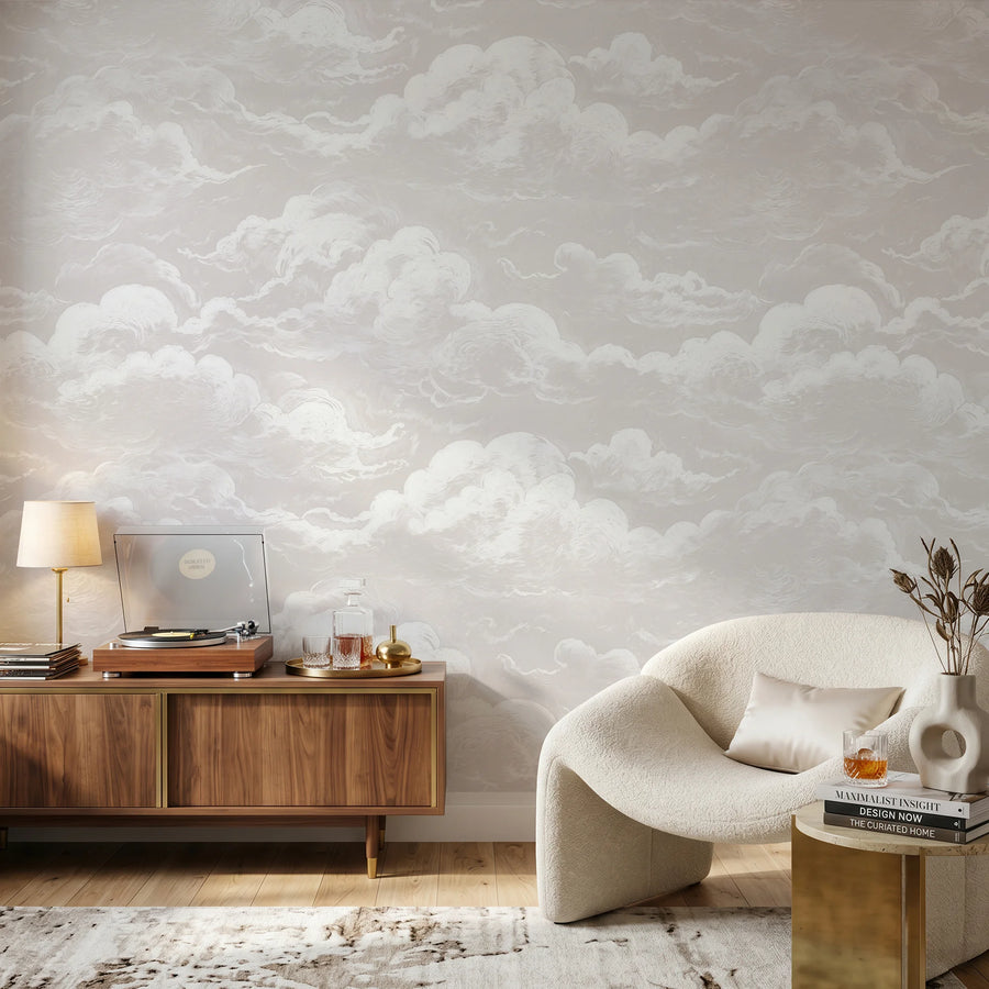 Dusty pink sky and clouds wall mural behind a wood credenza