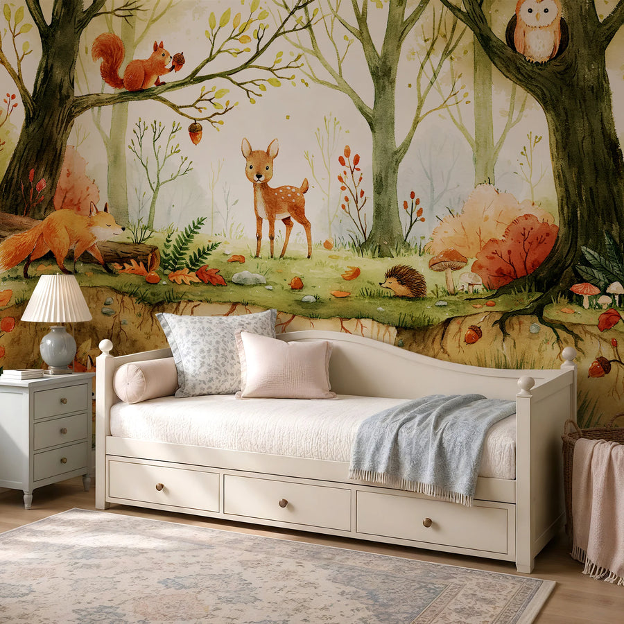 Fox, deer and owl forest animals mural behind a white daybed in a child's room