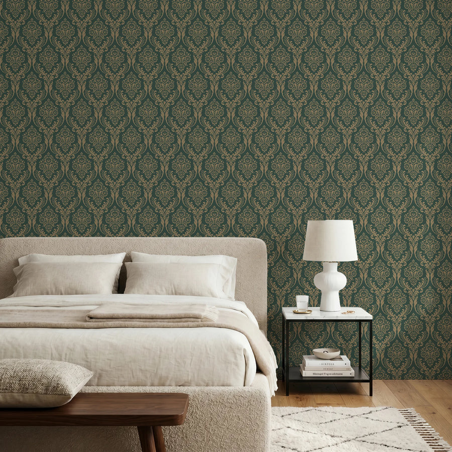 Green damask wallpaper in a bedroom with linen bedding