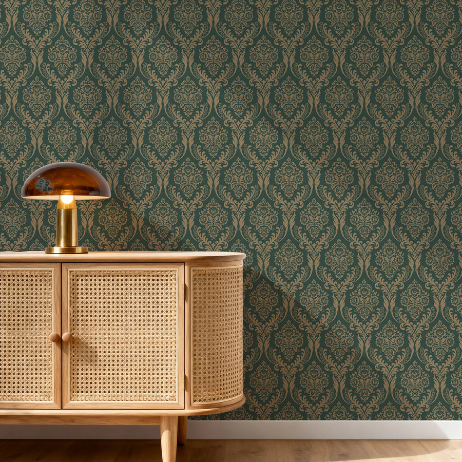 Green damask wallpaper behind a cane credenza with a mushroom lamp
