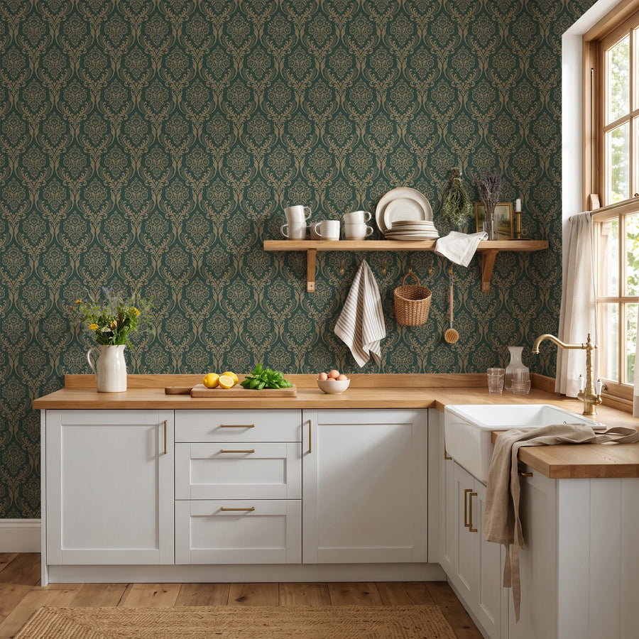 Green damask wallpaper in a kitchen with white cabinets and wood counter