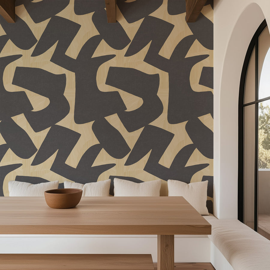 Intarsia charcoal and sand abstract cutout wallpaper styled in a contemporary interior