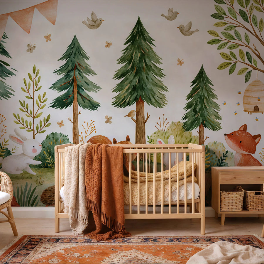 Watercolor pine forest animals mural behind a crib with a rust blanket and patterned rug