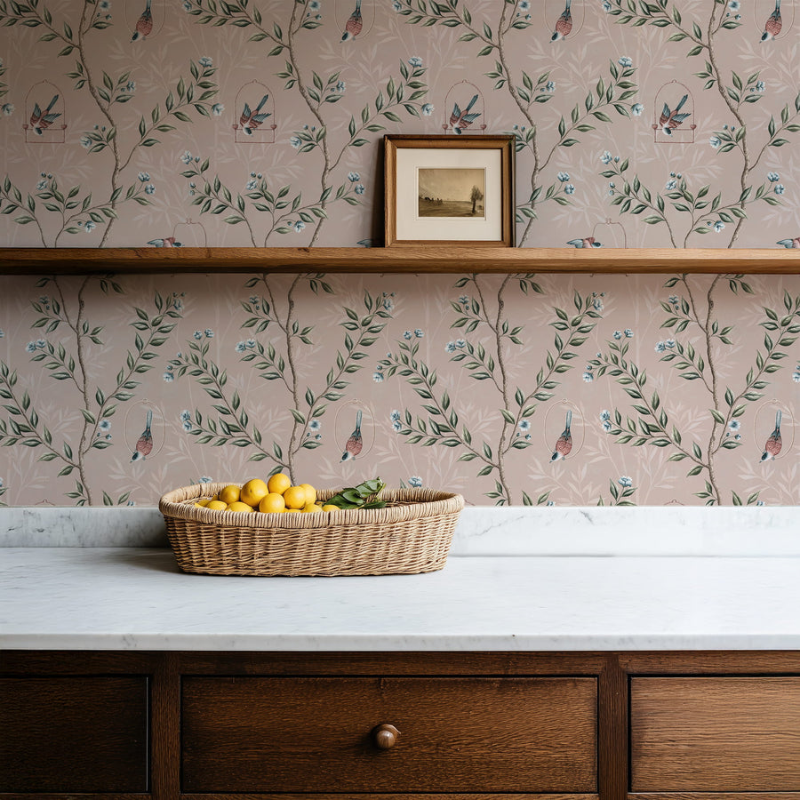 Console with wall shelf and fruit basket featuring Pink Chinoiserie Pauline Wallpaper Birds Branches accent wall