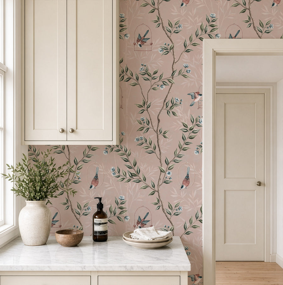 Kitchen pantry with vase cabinets and white door featuring Pink Chinoiserie Pauline Wallpaper Birds Branches accent wall