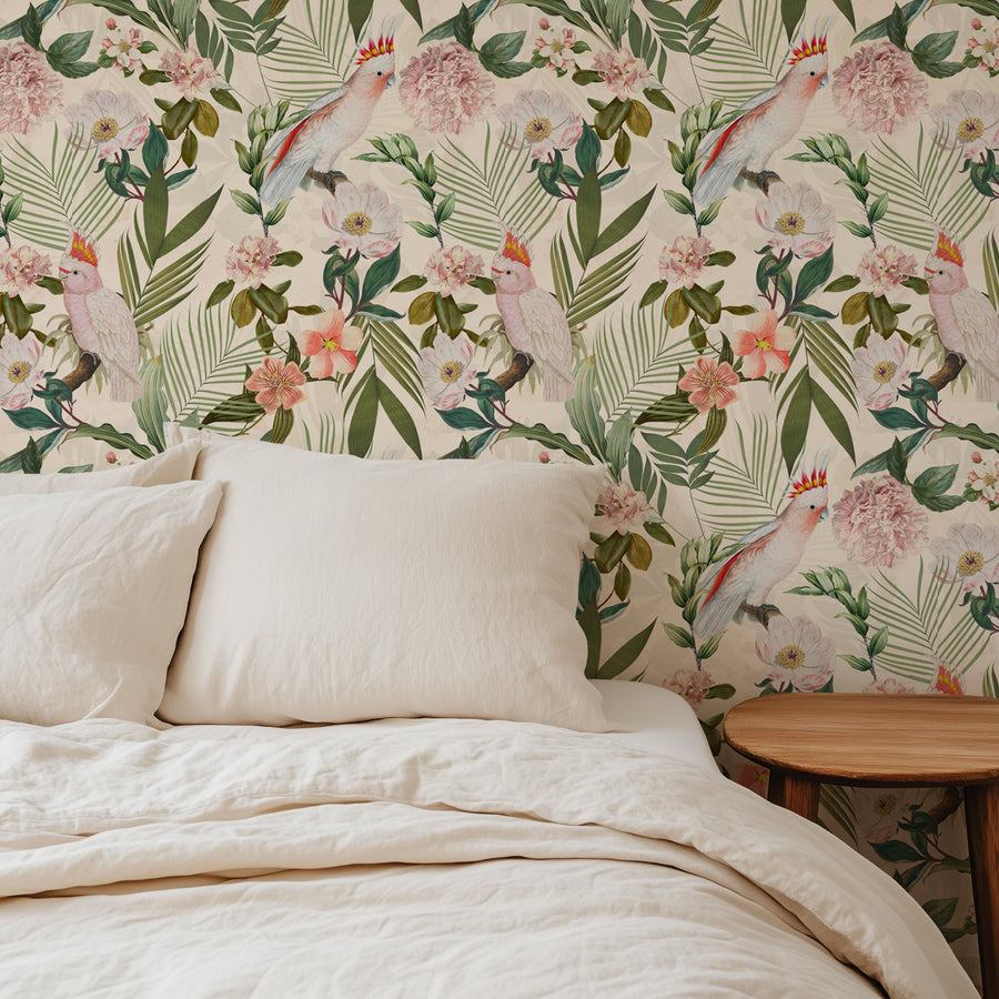 Pink cockatoo tropical floral wallpaper in a bedroom with linen bedding