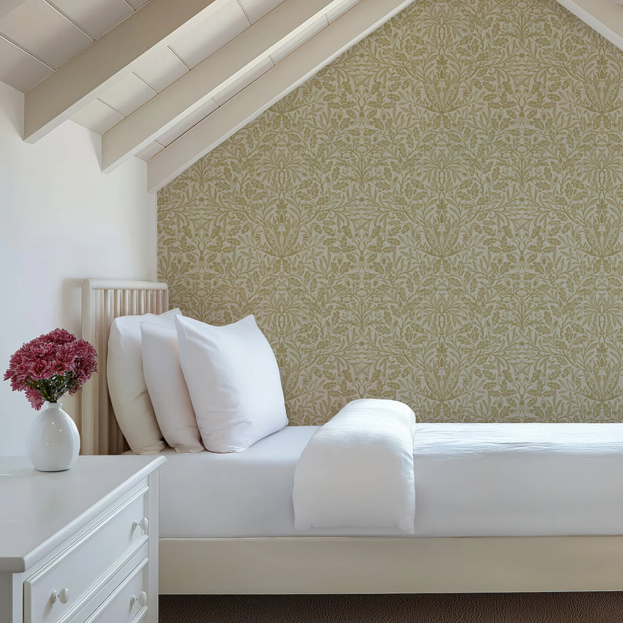 William Morris Acorn green wallpaper in a bedroom with linen bedding