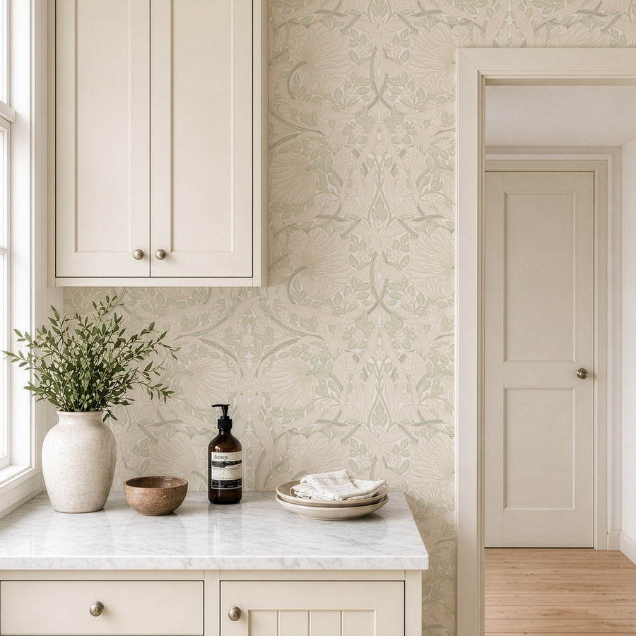 Beige and sage green William Morris Pimpernel wallpaper in a kitchen with marble counter