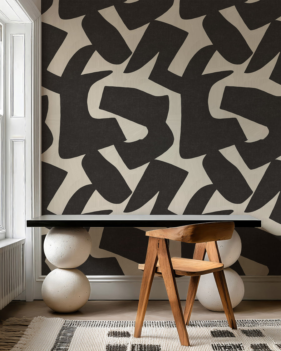 Woodland Intarsia black and cream textured wallpaper accent wall in a designer room setting