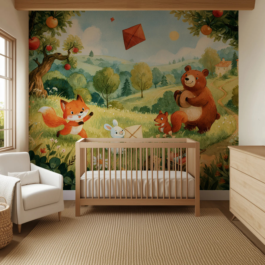 Woodland nursery wallpaper mural with apple trees, fox and bear flying kites behind a wooden crib and armchair