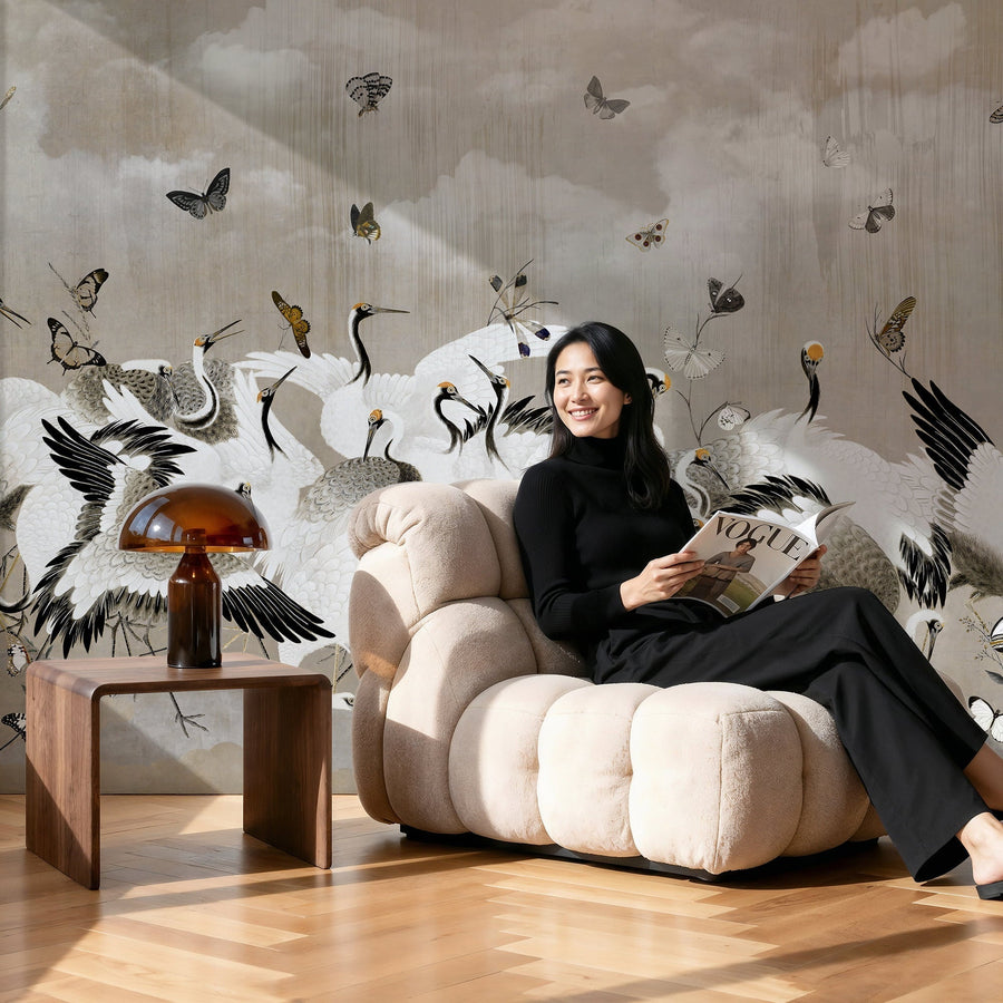 Woman reading the magazine against renter friendly crane wallpaper mural