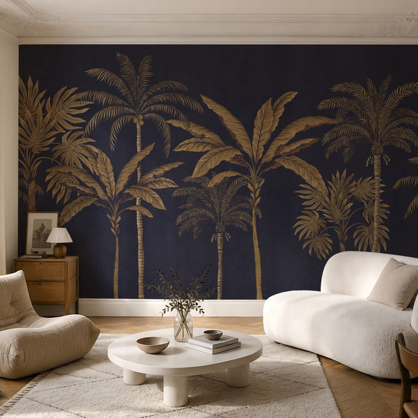 Navy and gold palm tree tropical wallpaper mural in a living room with boucle chairs