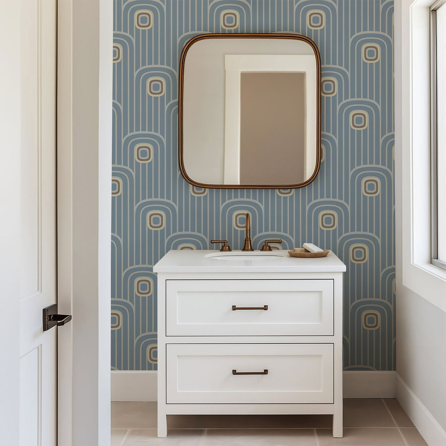 Bathroom vanity with mirror against a Dusty Blue 70s Retro Mod Arch Geometric Wallpaper