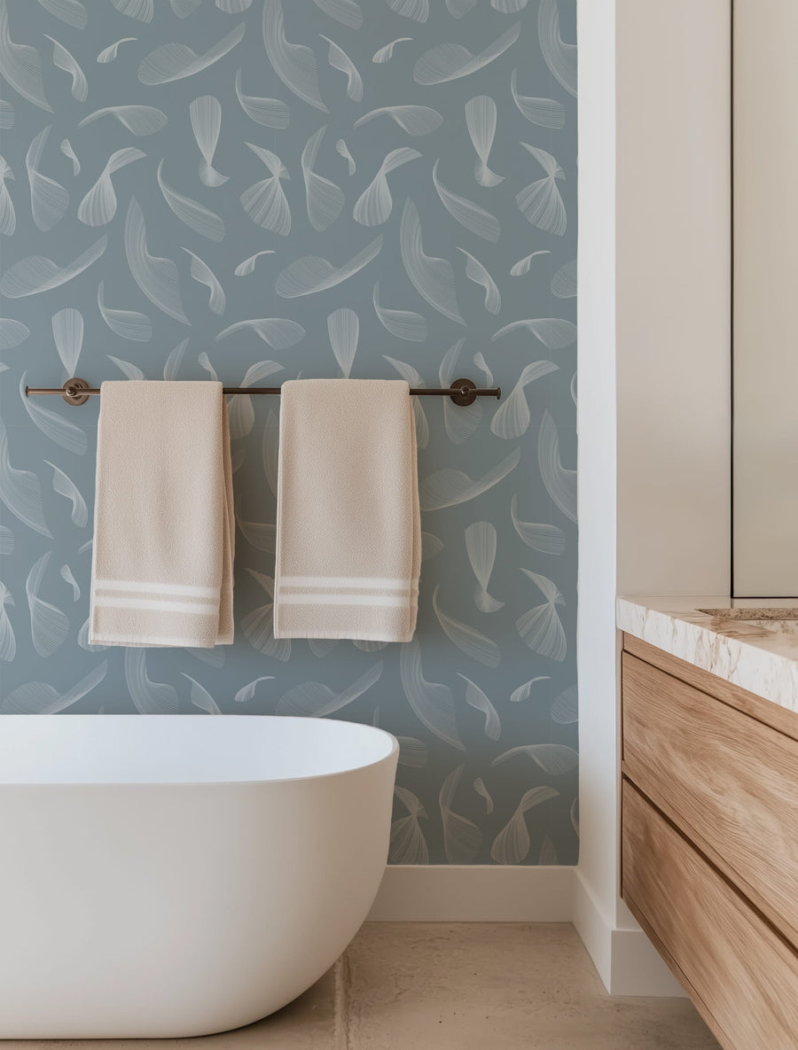 Bathroom with a freestanding bathtub, towel rack, and Quill Whispers Wallpaper – Slate Blue