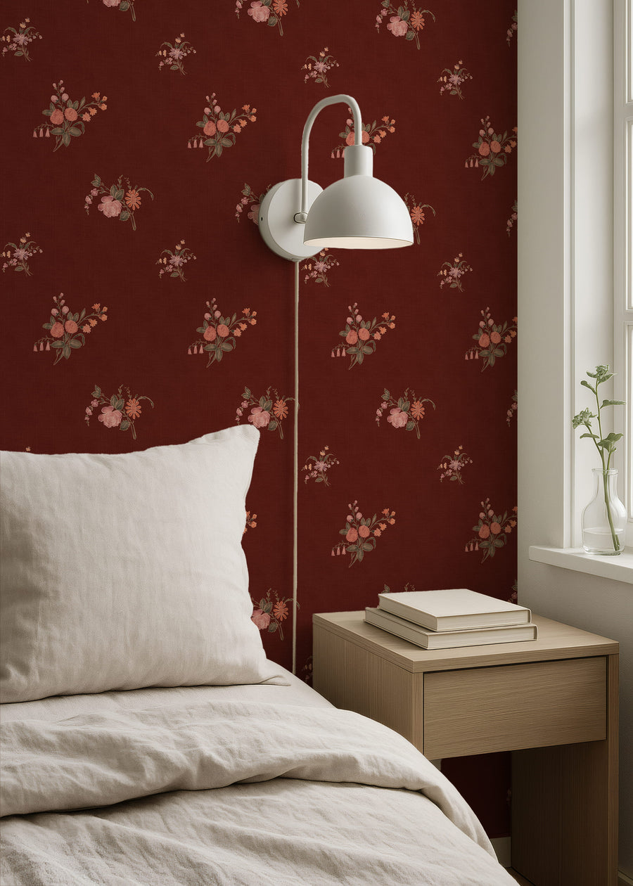 Bedroom with Burgundy Heritage Heirloom Floral Wallpaper, white wall lamp, and wooden nightstand.