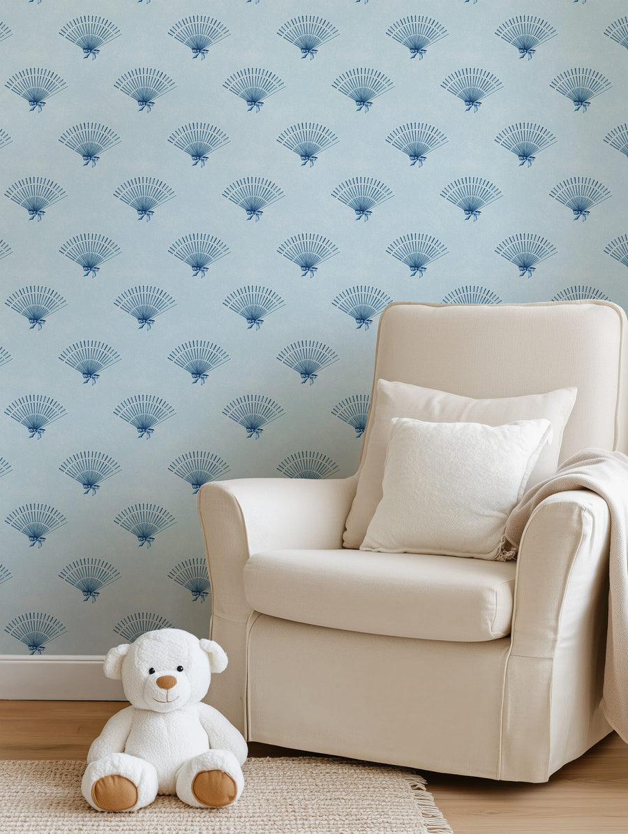 Beige armchair with white cushions and a teddy bear against a Blue Coquette Preppy Bow Fan Wallpaper