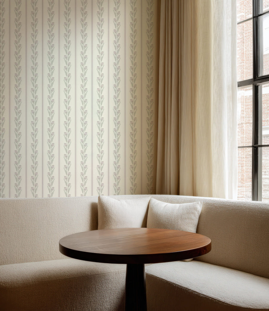 Beige sofa with a wooden table against a wall with Staircase with Cream and Pink Vintage Tulip and Stripe Wallpaper