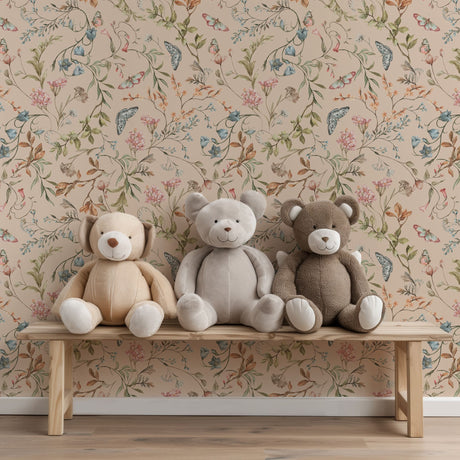 Three teddy bears sitting on a wooden bench against a floral wallpaper background