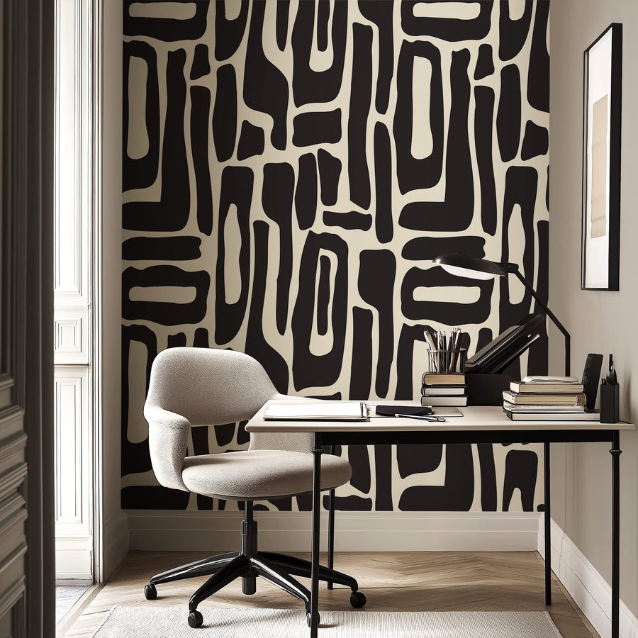 Modern office setup with a desk, chair, and Modern Abstract Black and White Geometric Wallpaper.