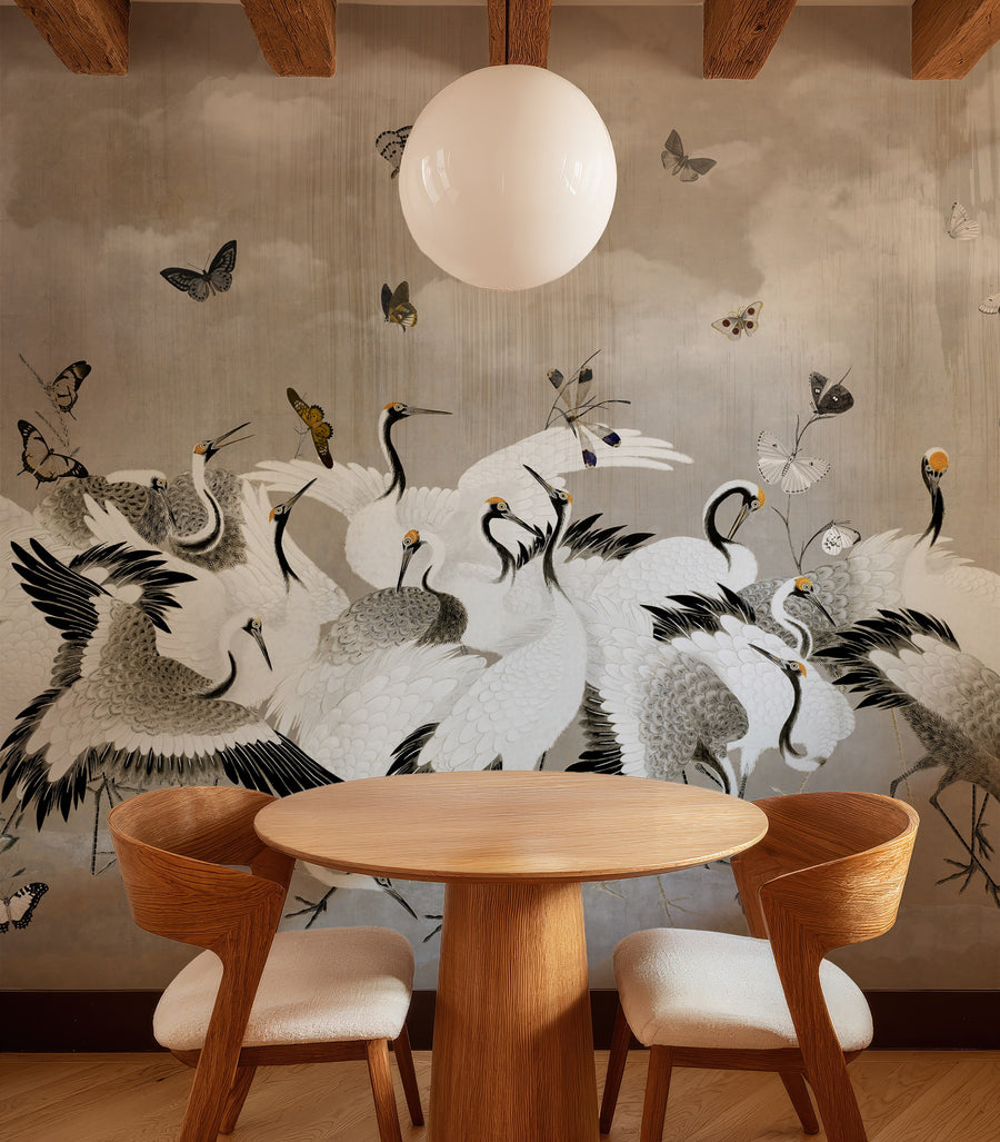 Dining area with a table and chairs in front of a Beige Japanese Chinoiserie Cranes Wall Mural